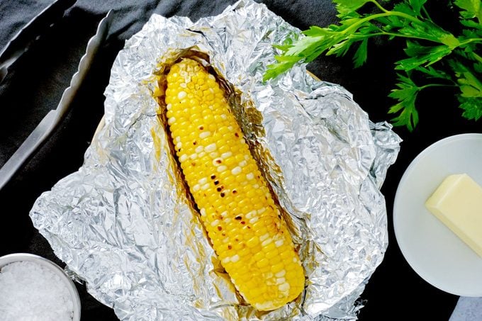an ear of corn of foil after being Grilled
